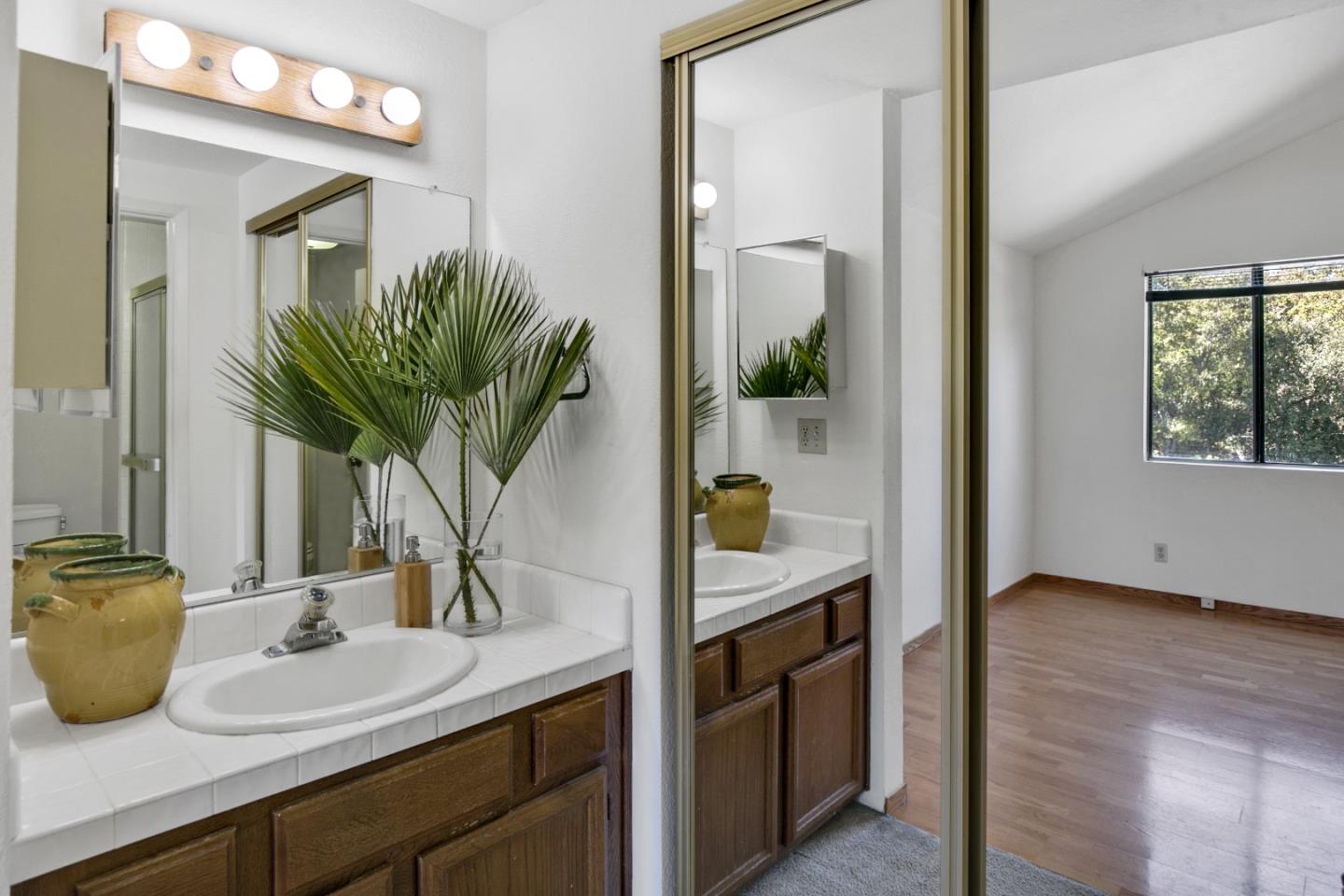 20 Seacliff Drive Aptos, CA 95003 - Photo 22 of 38 a kitchen with a sink and a mirror