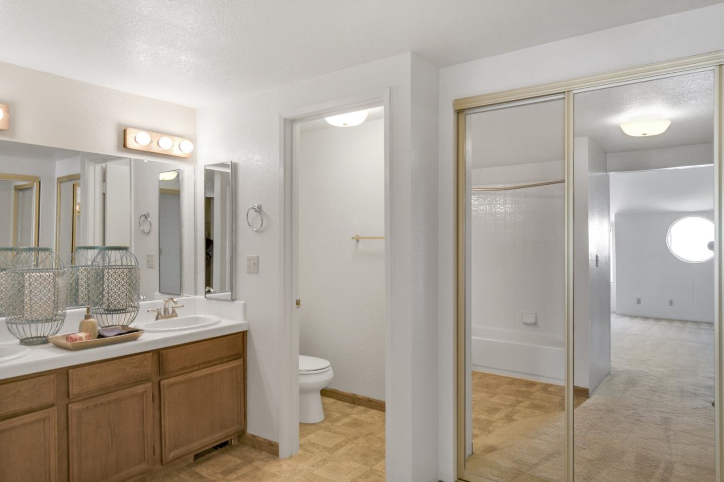 20 Seacliff Drive Aptos, CA 95003 - Photo 26 of 38 a bathroom with a double vanity sink mirror and toilet