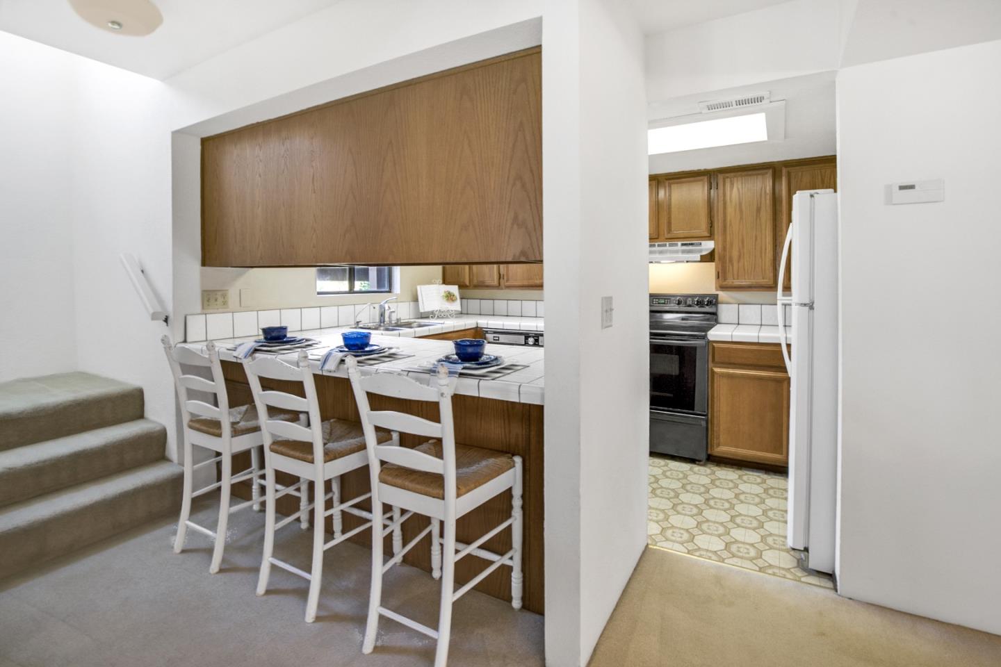 20 Seacliff Drive Aptos, CA 95003 - Photo 7 of 38 a kitchen with a table and chairs in it
