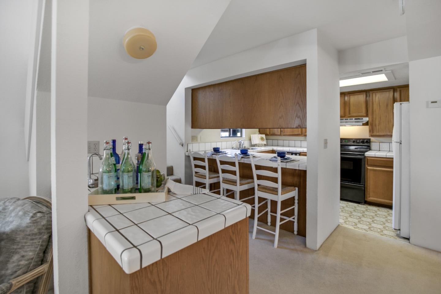 20 Seacliff Drive Aptos, CA 95003 - Photo 8 of 38 a kitchen with a table and chairs in it
