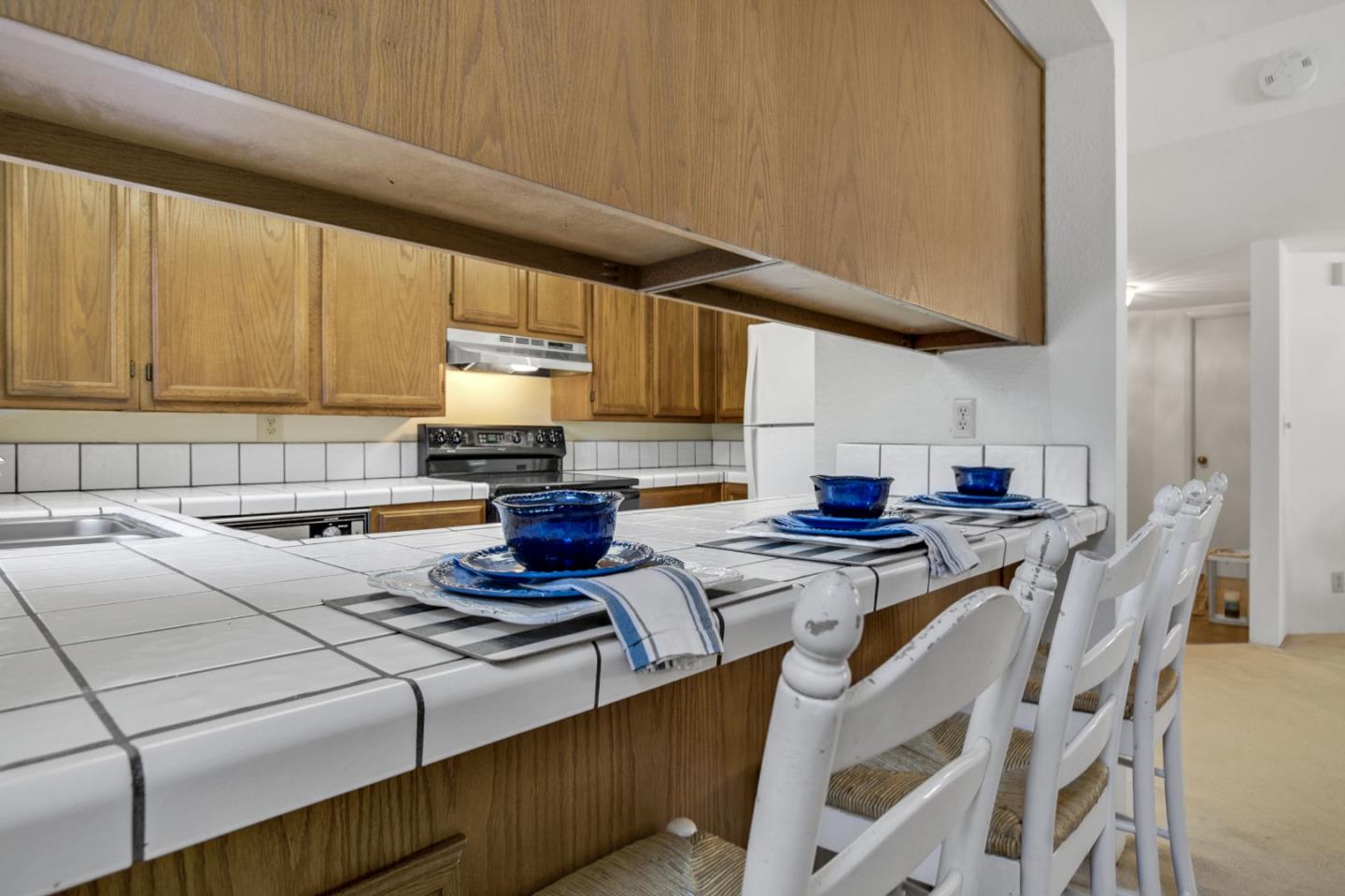 20 Seacliff Drive Aptos, CA 95003 - Photo 9 of 38 a kitchen with stainless steel appliances granite countertop a stove a sink dishwasher and cabinets