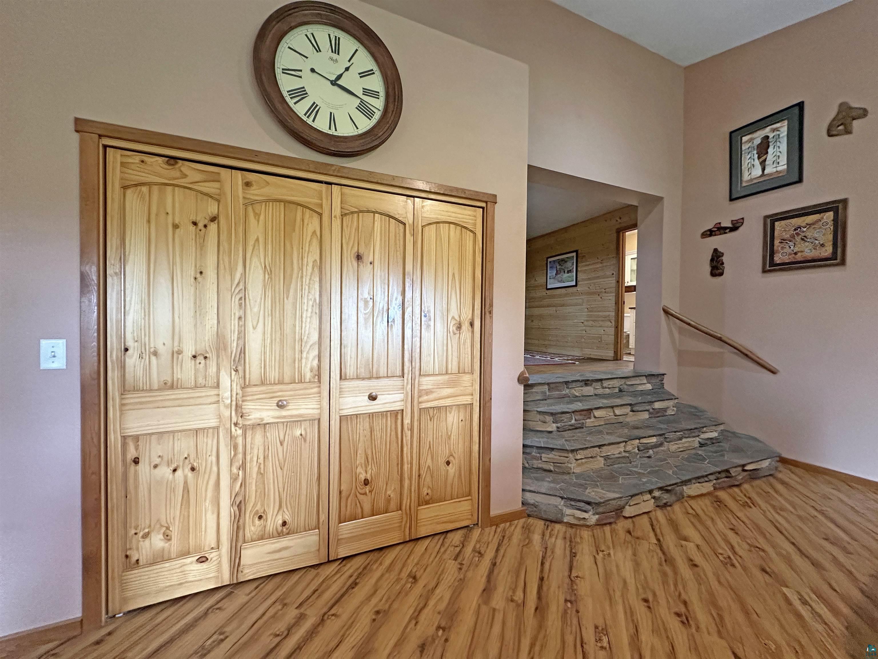 5865 Eastview Road Iron River, WI 54847 - Photo 11 of 41 Stairs featuring wood-type flooring