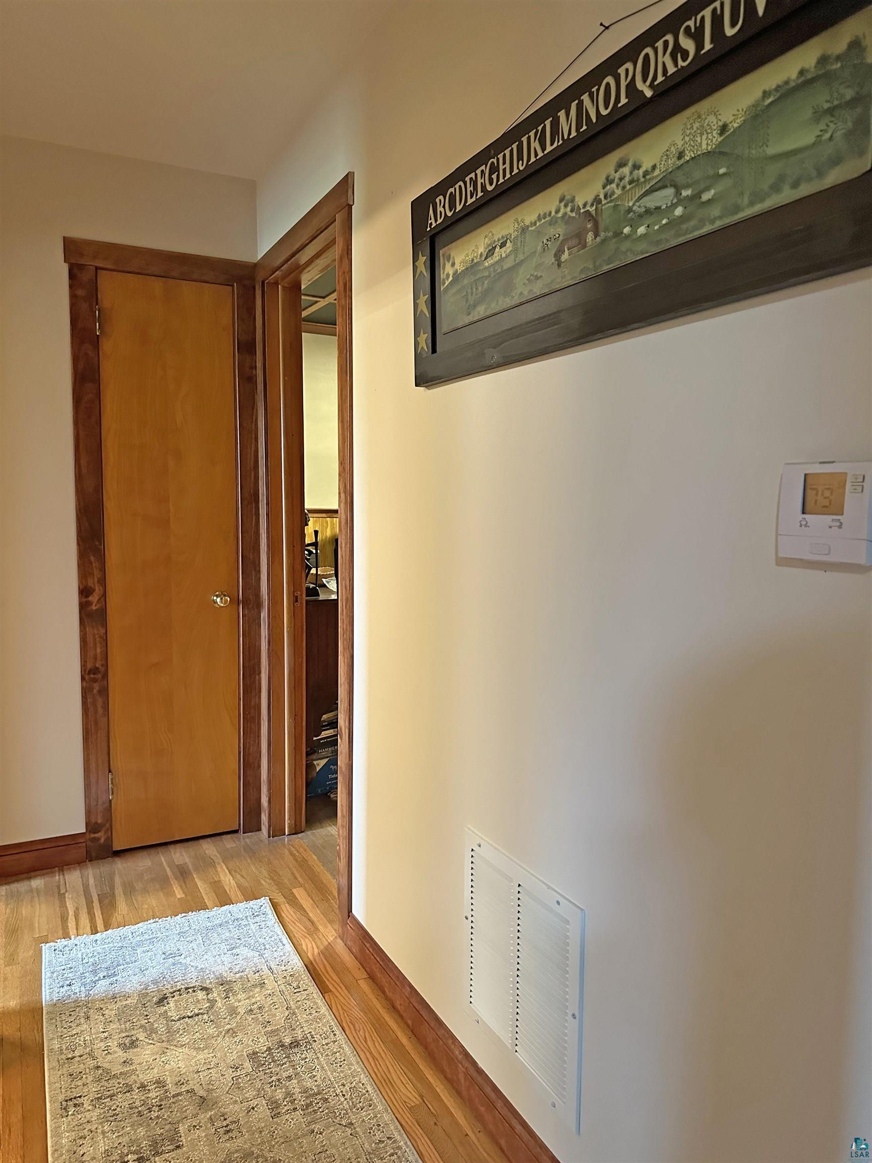5865 Eastview Road Iron River, WI 54847 - Photo 22 of 41 Hallway featuring light hardwood / wood-style flooring