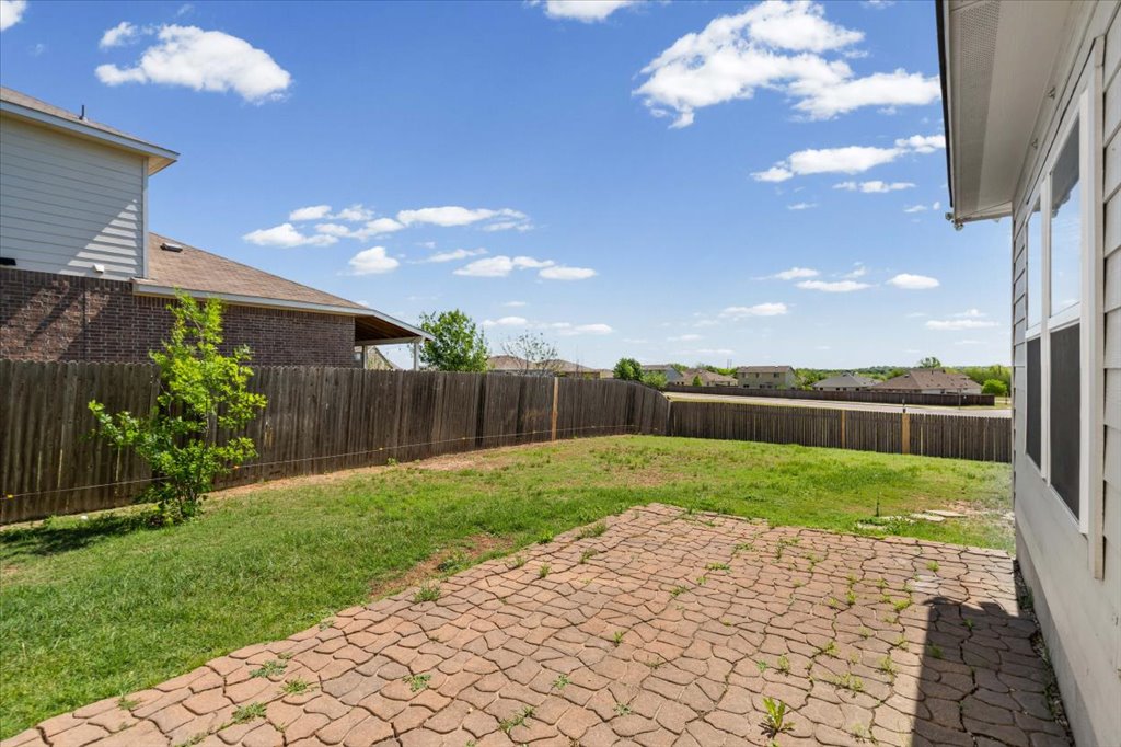312 Waterloo Drive Kyle, TX 78640 - Photo 30 of 31 Back patio -- a lovely place to sit and enjoy the view!