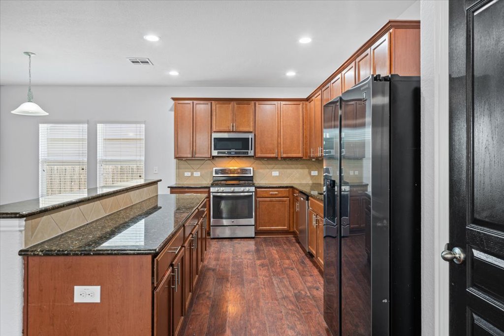 312 Waterloo Drive Kyle, TX 78640 - Photo 7 of 31 Plentiful countertop and cabinet space makes cooking a breeze!