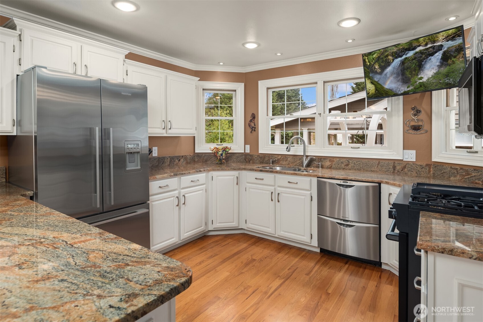 17409 113th Avenue Northeast Bothell, WA 98011 - Photo 14 of 39 a kitchen with stainless steel appliances granite countertop a refrigerator a stove a sink and a microwave