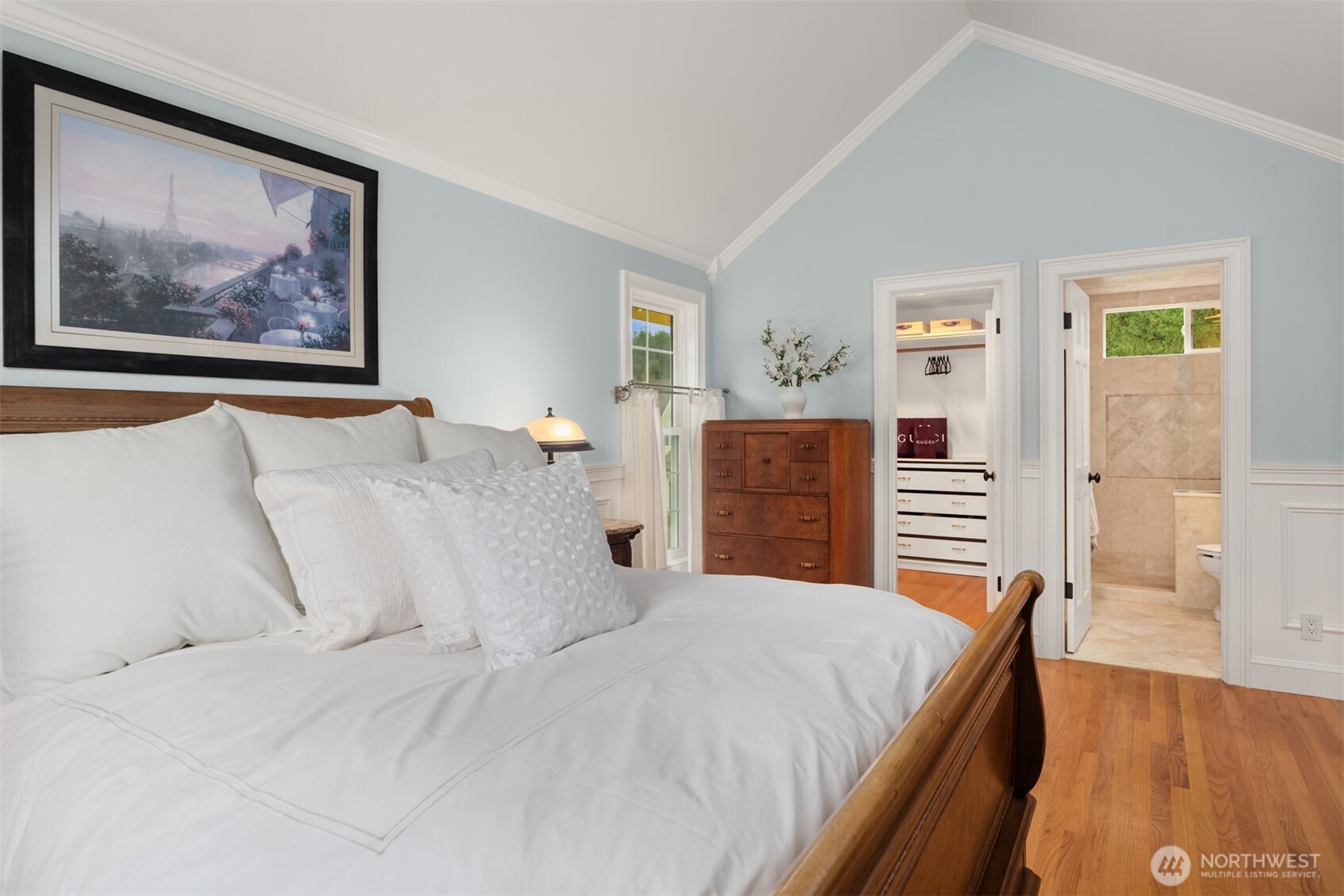 17409 113th Avenue Northeast Bothell, WA 98011 - Photo 19 of 39 a bedroom with a large bed and a painting on the wall