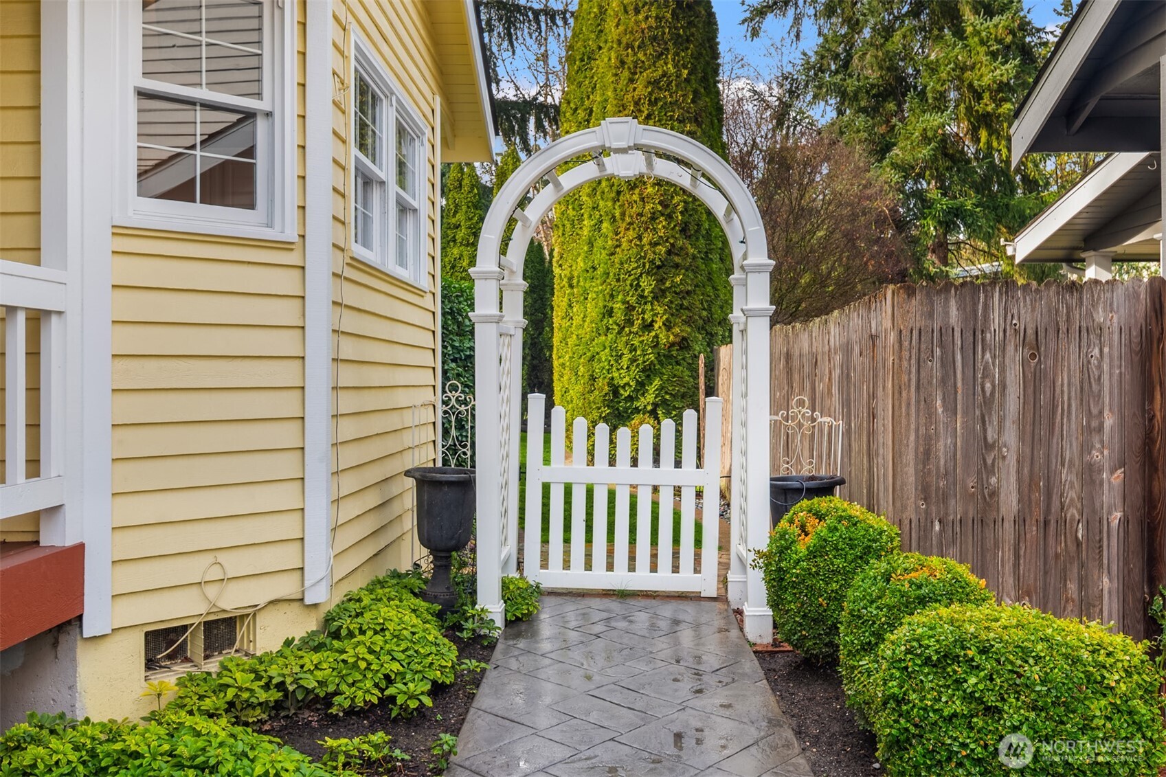 17409 113th Avenue Northeast Bothell, WA 98011 - Photo 32 of 39 a view of a house with a small yard and wooden fence
