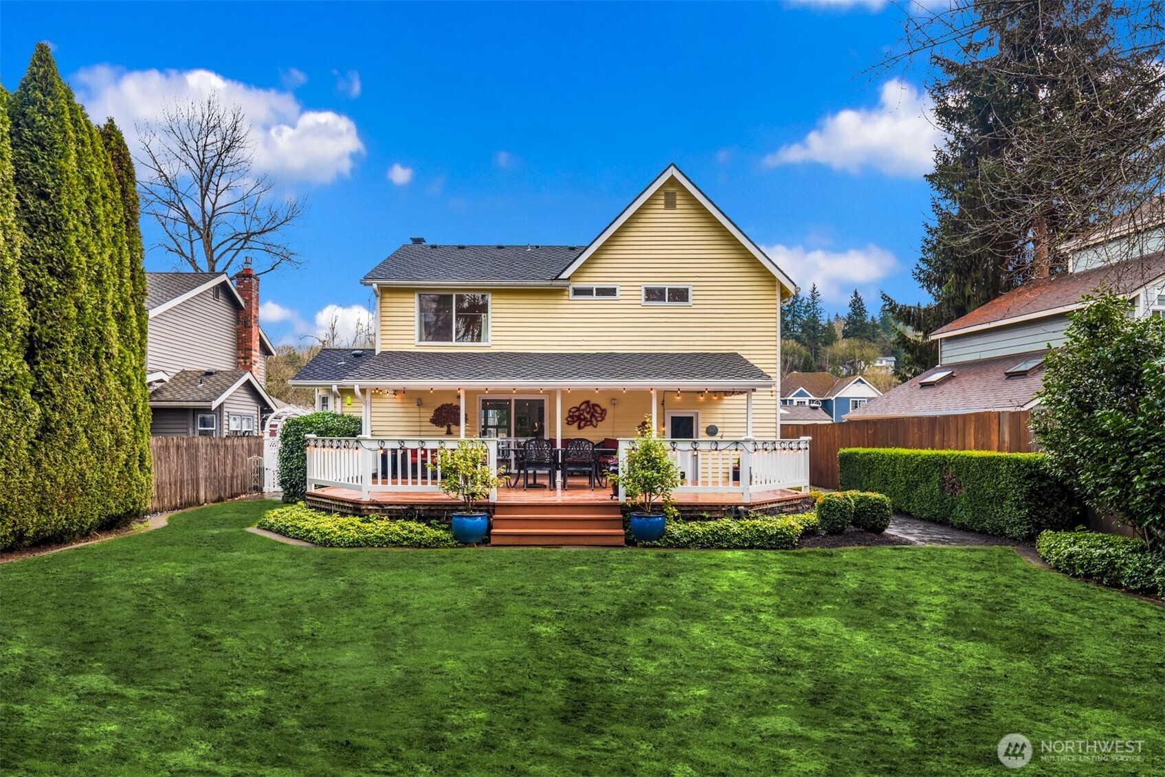 17409 113th Avenue Northeast Bothell, WA 98011 - Photo 33 of 39 a front view of a house with a yard table and chairs