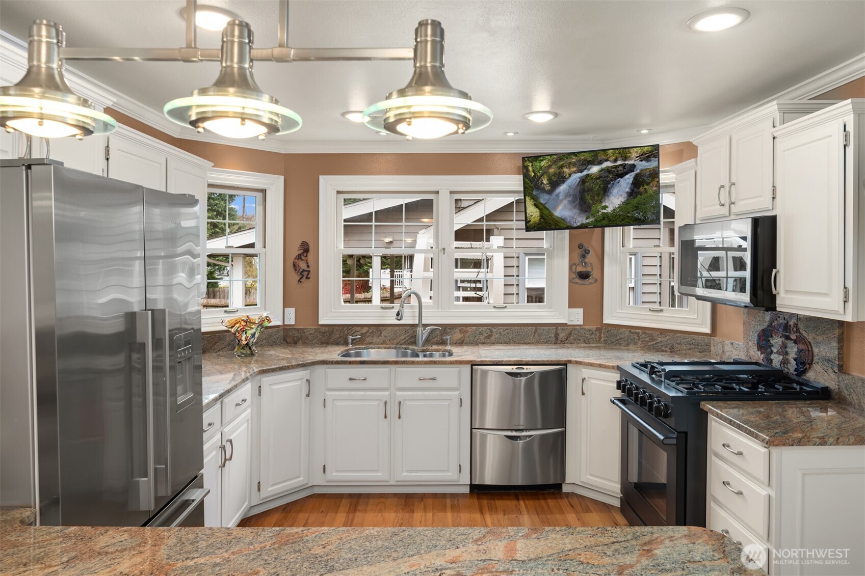 17409 113th Avenue Northeast Bothell, WA 98011 - Photo 4 of 39 a kitchen with a sink stove and refrigerator