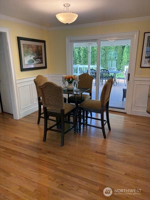 17409 113th Avenue Northeast Bothell, WA 98011 - Photo 5 of 39 a view of a dining room with furniture window and wooden floor