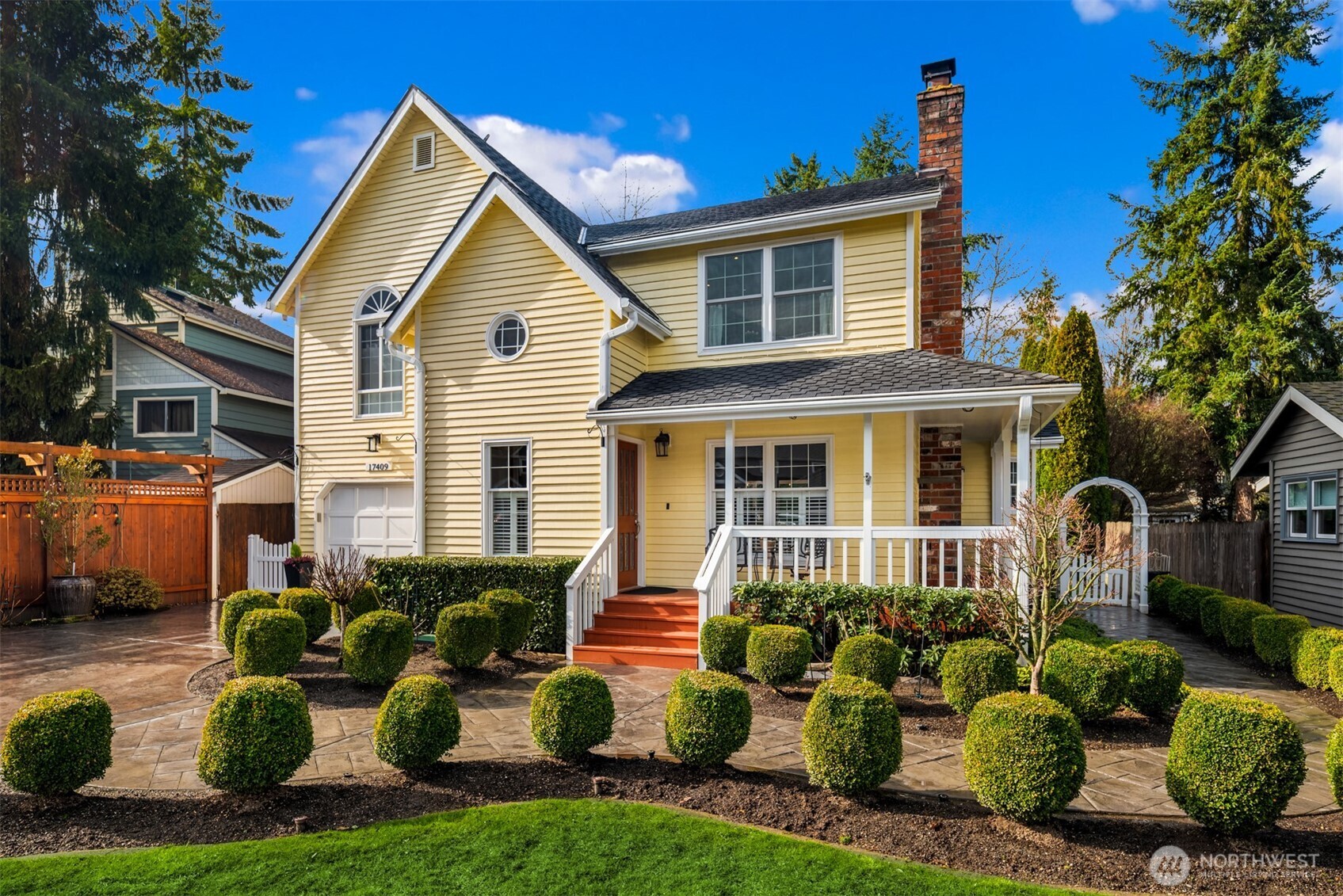 17409 113th Avenue Northeast Bothell, WA 98011 - Photo 9 of 39 a front view of a house with a yard and potted plants