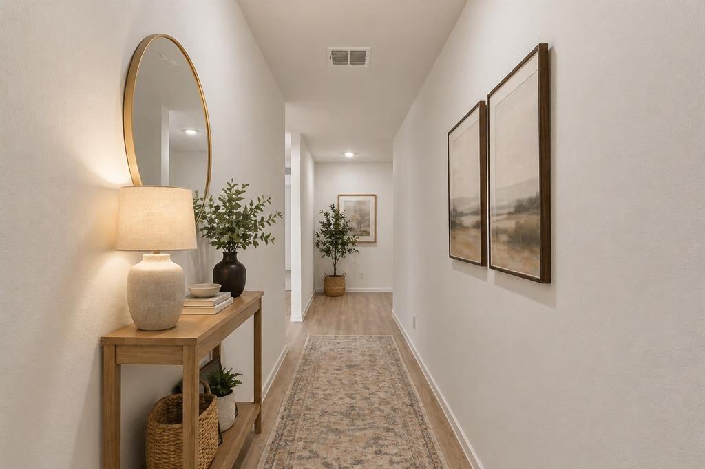 1138 Barbary Flds Street Forney, TX 75126 - Photo 18 of 25 Hallway with wood-finish flooring and light neutral walls