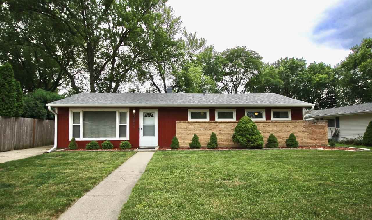 4613 Cayuga Road Rockford, IL 61107 - Photo 1 of 19 a front view of a house with garden