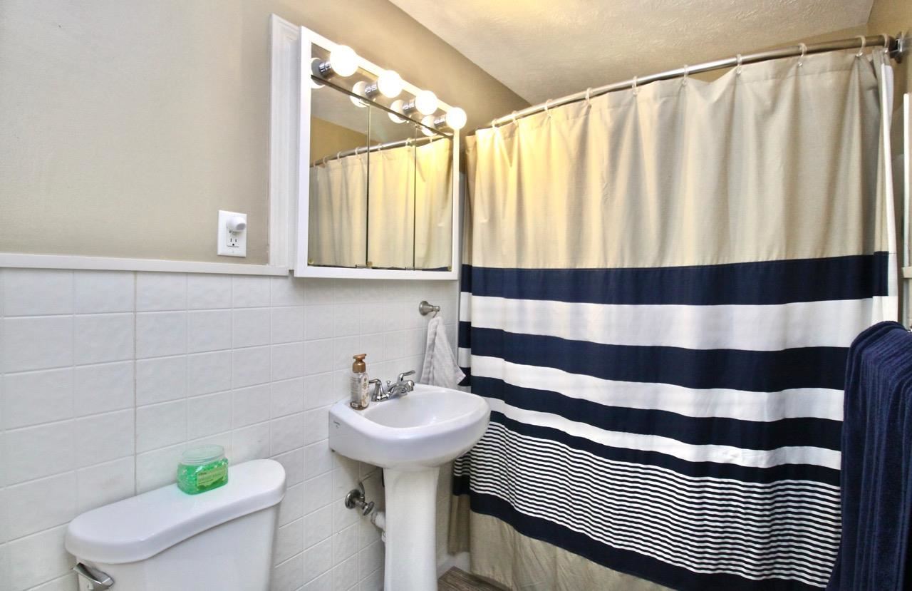 4613 Cayuga Road Rockford, IL 61107 - Photo 14 of 19 a bathroom with a sink and a mirror