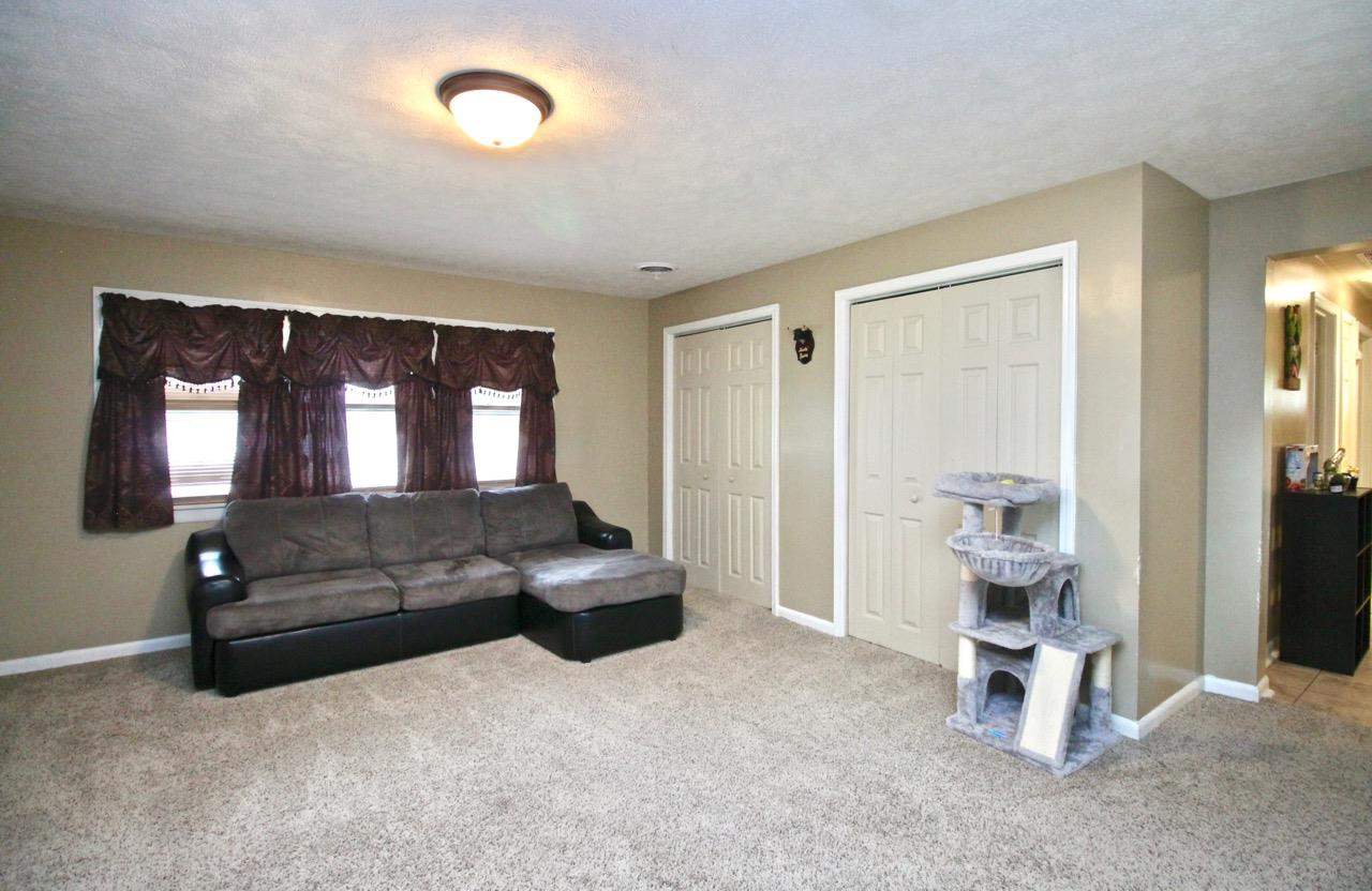 4613 Cayuga Road Rockford, IL 61107 - Photo 16 of 19 a living room with furniture and a window