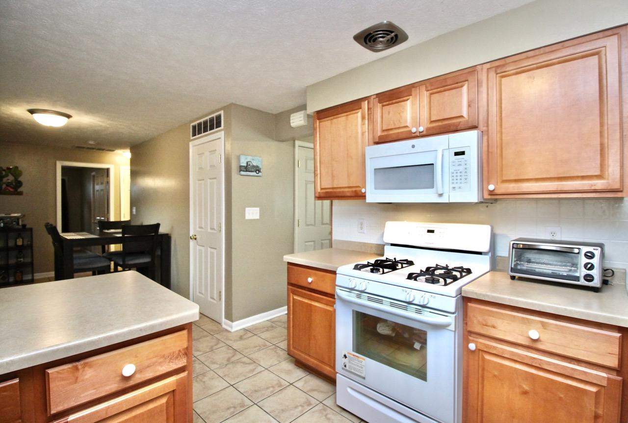 4613 Cayuga Road Rockford, IL 61107 - Photo 9 of 19 a kitchen with kitchen island a sink stove and refrigerator