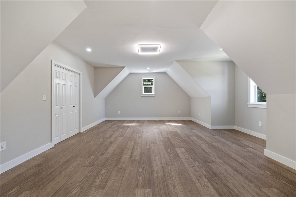 8 Wilson Street Spencer, MA 01562 - Photo 19 of 41 an empty room with wooden floor and windows