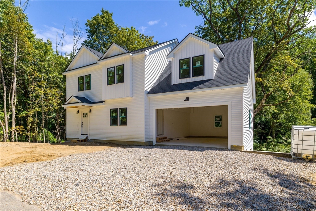 8 Wilson Street Spencer, MA 01562 - Photo 2 of 41 a view of a house with a yard and large tree