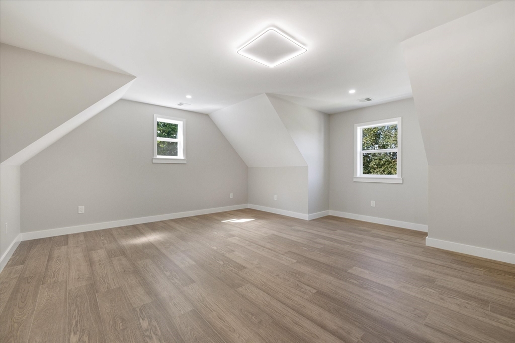 8 Wilson Street Spencer, MA 01562 - Photo 21 of 41 an empty room with wooden floor and windows