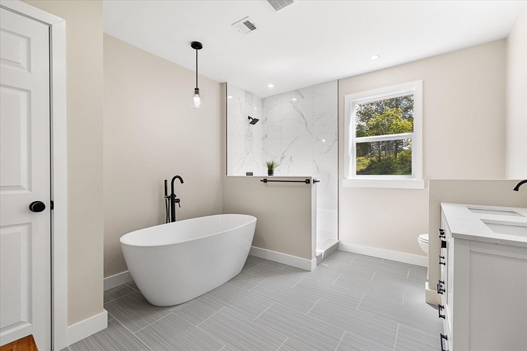 8 Wilson Street Spencer, MA 01562 - Photo 23 of 41 a view of an empty room with a window