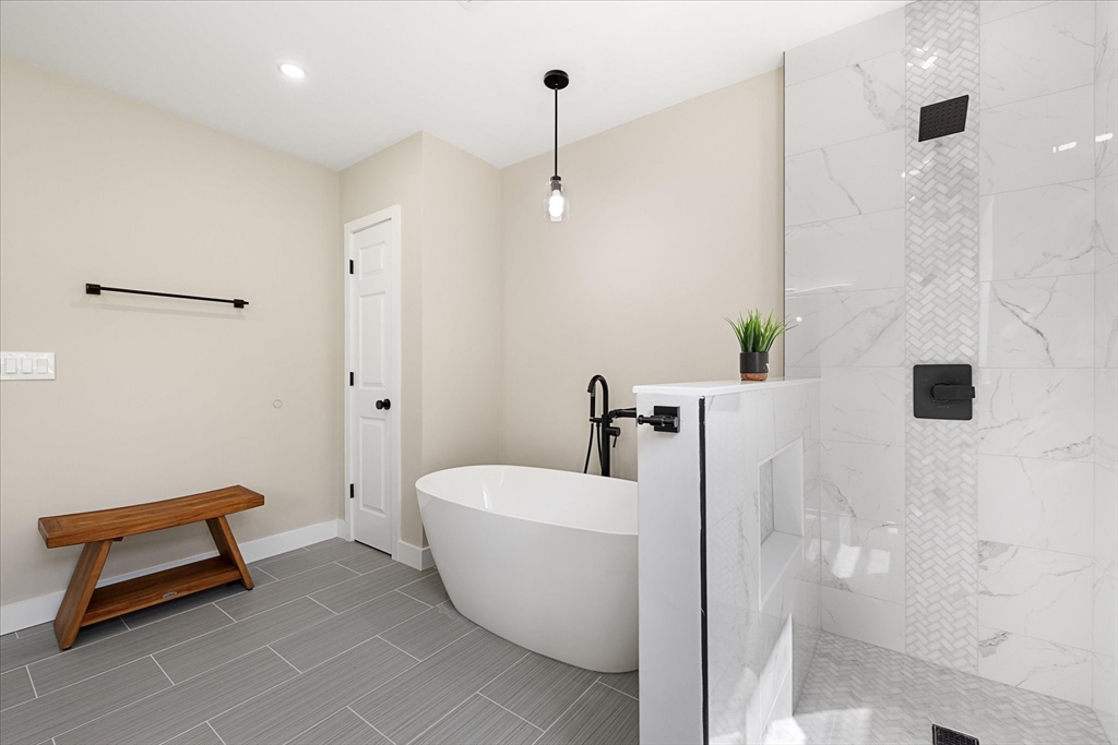 8 Wilson Street Spencer, MA 01562 - Photo 25 of 41 a bathroom with a bathtub and window