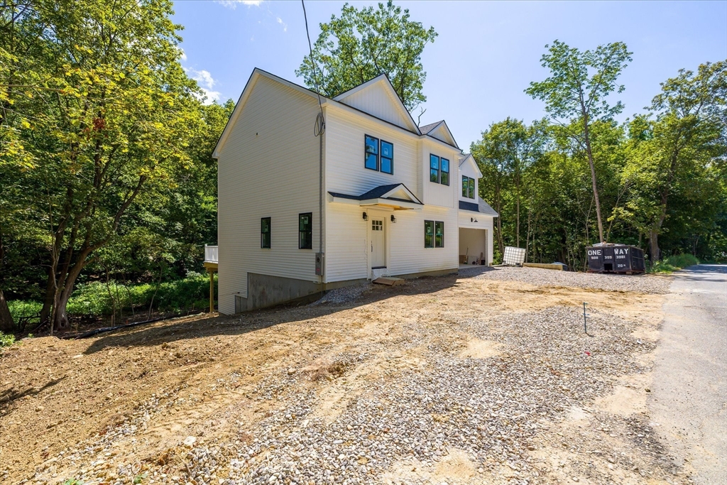 8 Wilson Street Spencer, MA 01562 - Photo 3 of 41 a view of a white house with a yard and large tree
