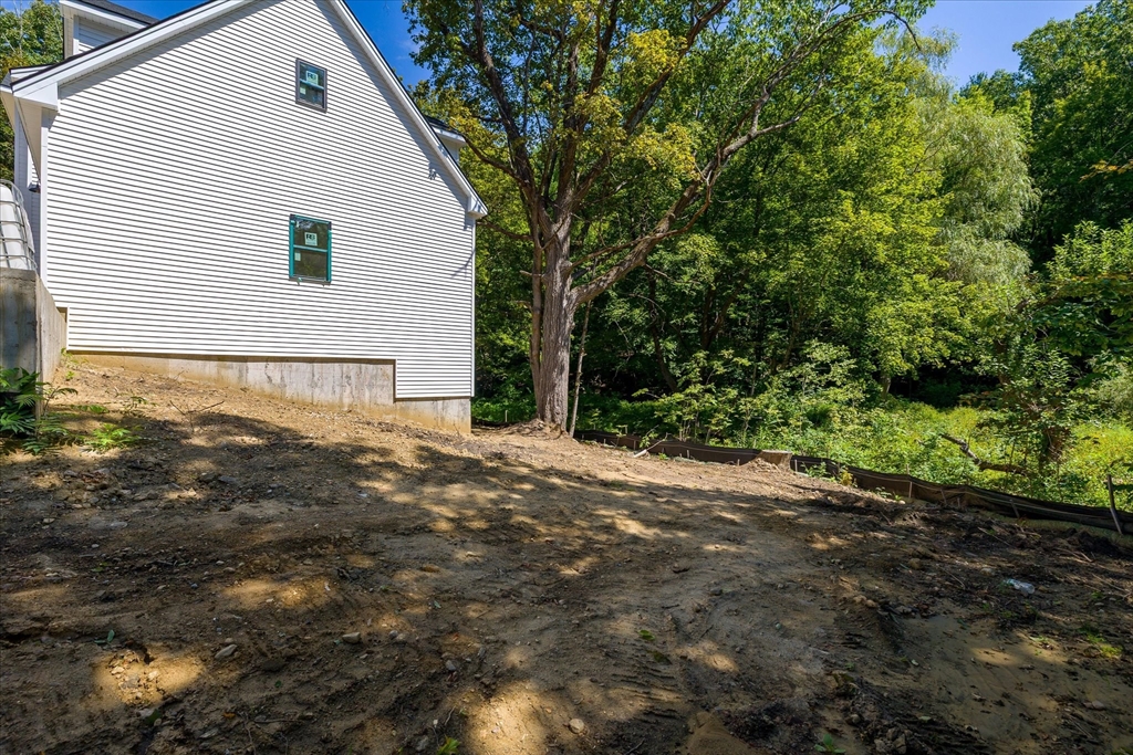 8 Wilson Street Spencer, MA 01562 - Photo 34 of 41 a view of a backyard with large trees