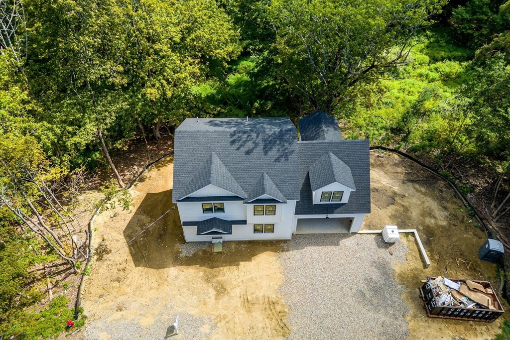 8 Wilson Street Spencer, MA 01562 - Photo 37 of 41 an aerial view of a house with a yard and large trees