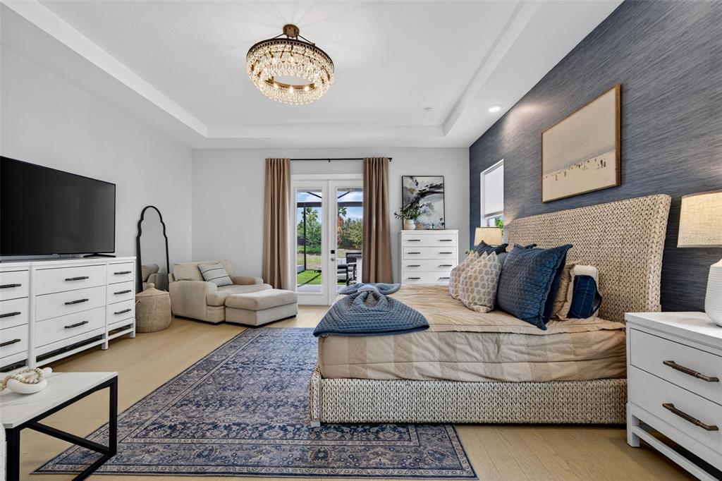 8331 Redonda Loop Lakewood Ranch, FL 34202 - Photo 25 of 92 a living room with furniture and a flat screen tv
