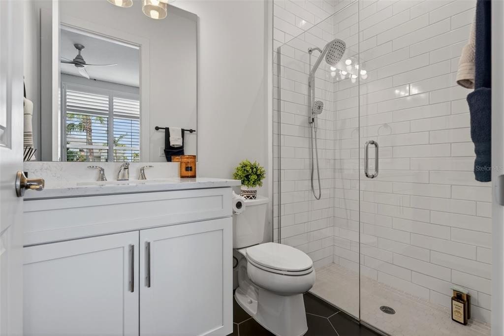 8331 Redonda Loop Lakewood Ranch, FL 34202 - Photo 45 of 92 a bathroom with a sink a toilet and shower