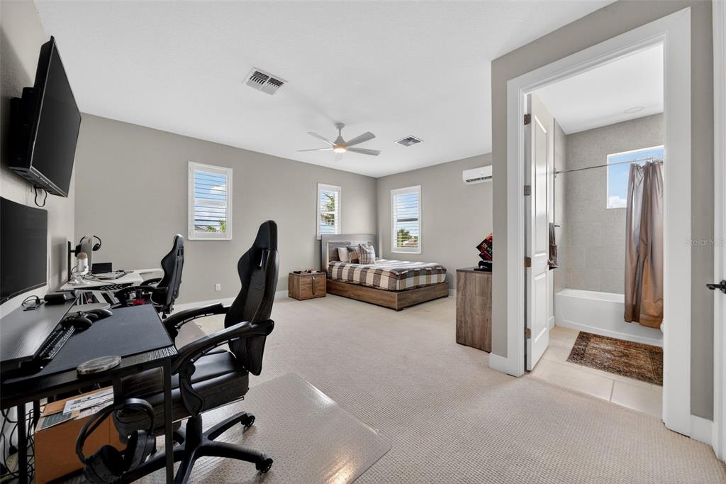 8331 Redonda Loop Lakewood Ranch, FL 34202 - Photo 46 of 92 a view of a livingroom with furniture and a flat screen tv