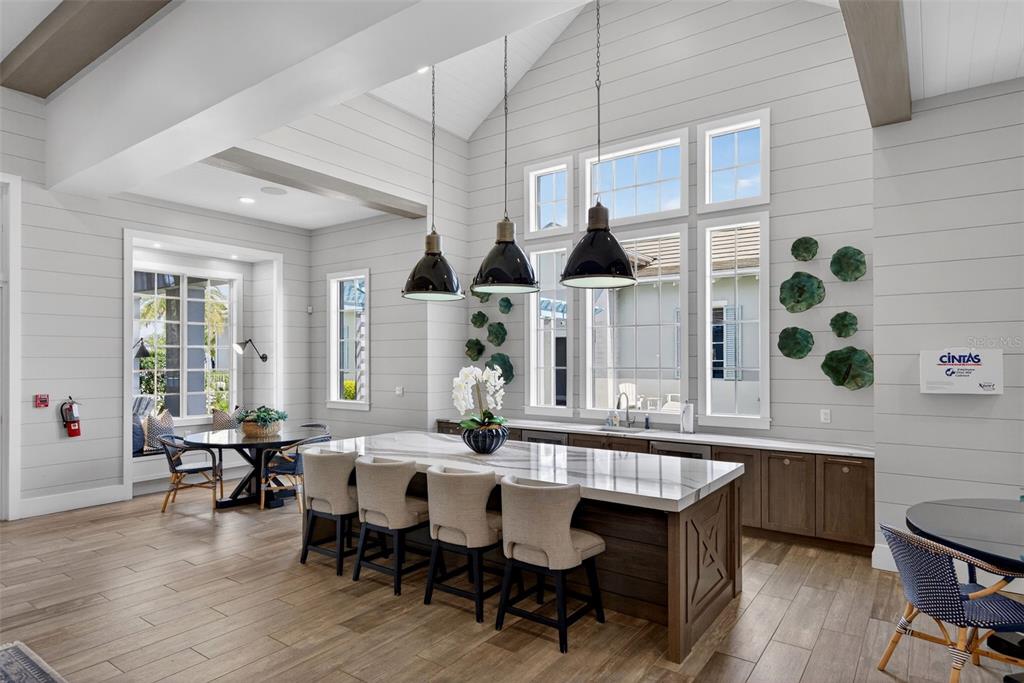 8331 Redonda Loop Lakewood Ranch, FL 34202 - Photo 78 of 92 a view of a dining room with furniture window and wooden floor