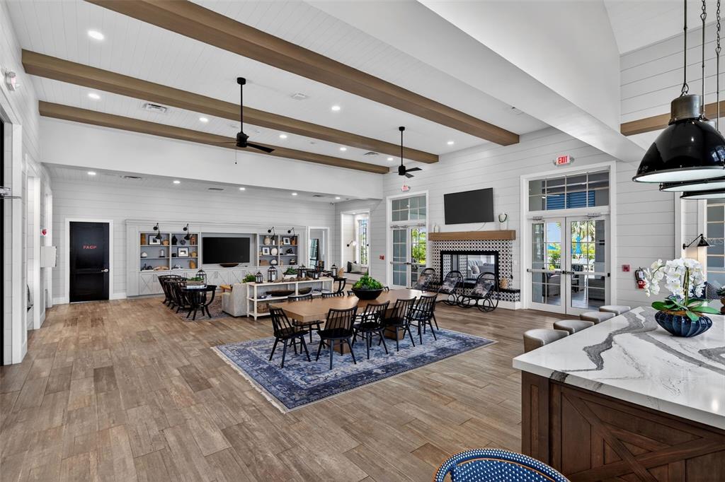8331 Redonda Loop Lakewood Ranch, FL 34202 - Photo 79 of 92 a living room with furniture flat screen tv and a fireplace