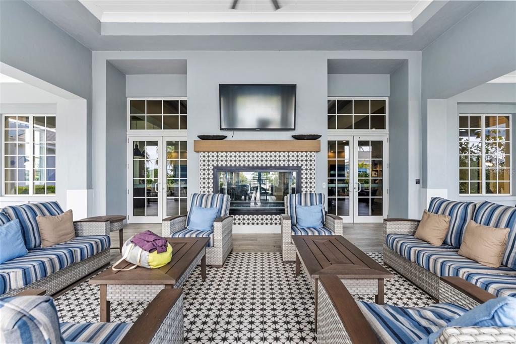 8331 Redonda Loop Lakewood Ranch, FL 34202 - Photo 80 of 92 a living room with furniture and a fireplace