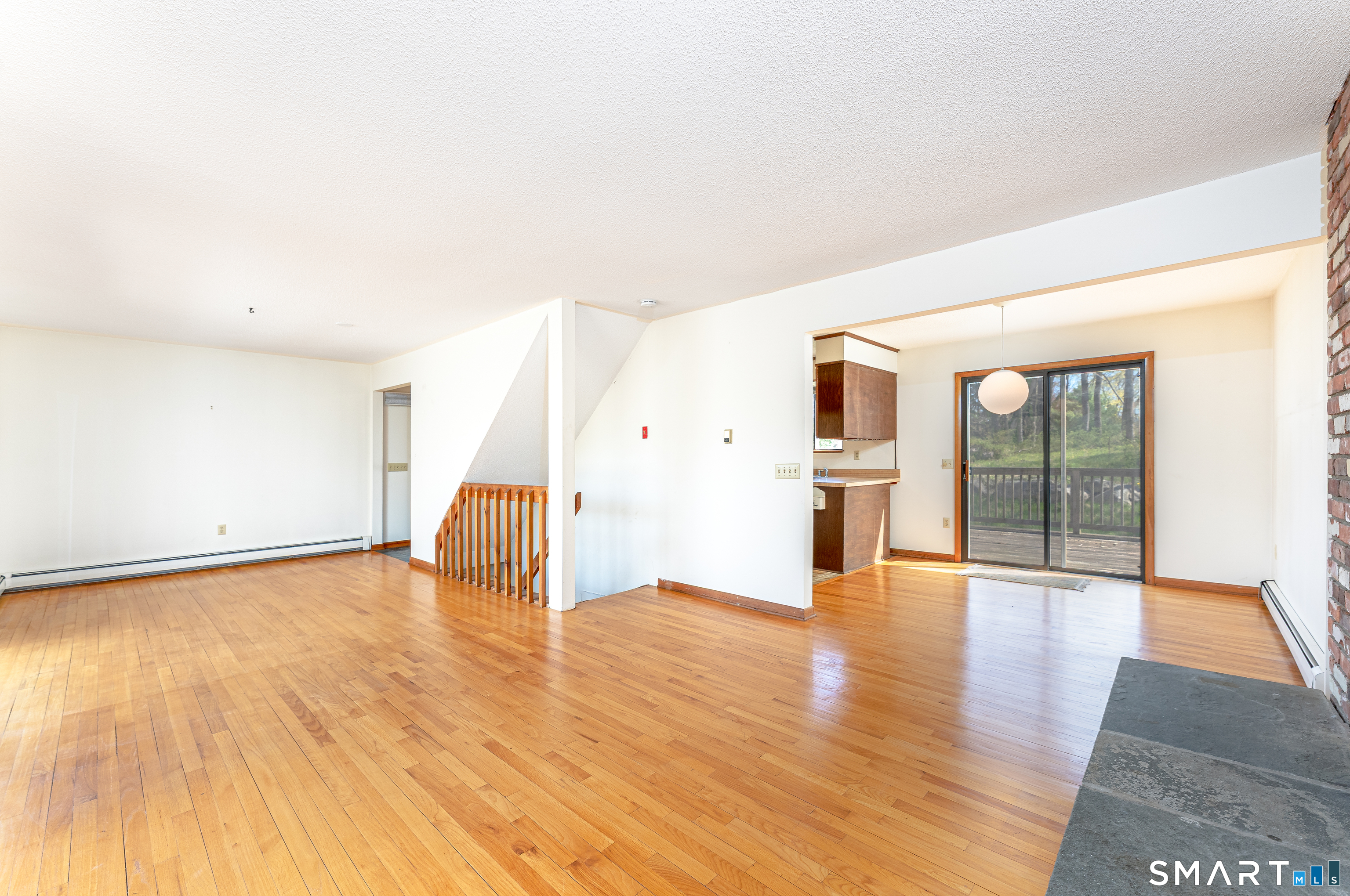 737 Leetes Island Road Guilford, CT 06437 - Photo 19 of 40 living room looking into dining area