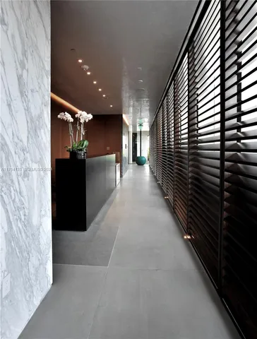 a view of a patio with swimming pool and furniture