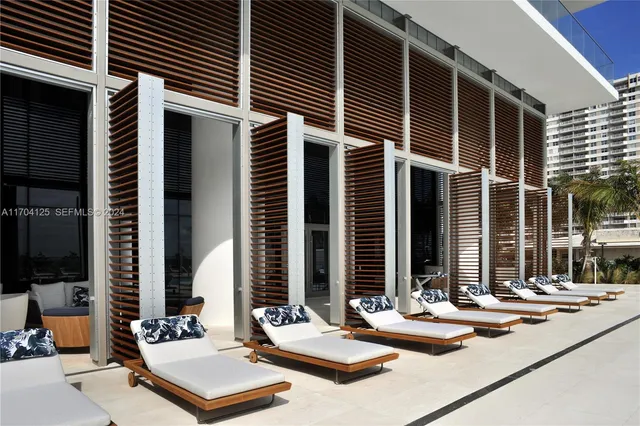 a swimming pool with outdoor seating