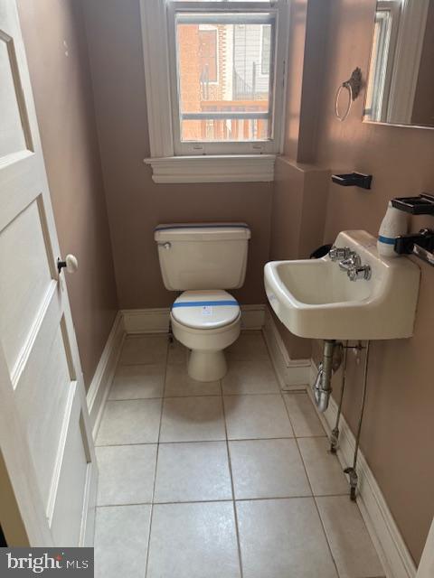 331 5th Street Southeast Washington, DC 20003 - Photo 7 of 27 a bathroom with a toilet a sink and a window