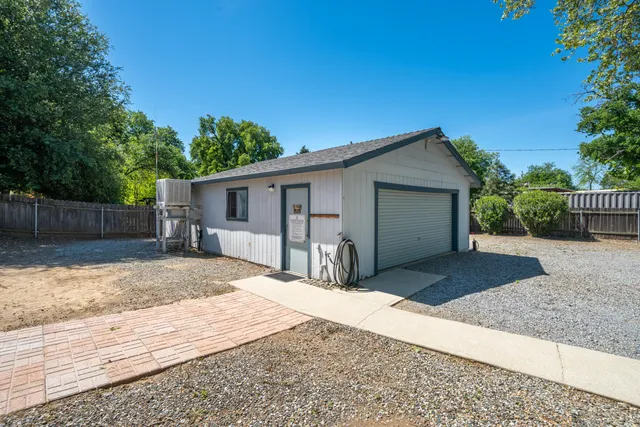 an aerial view of a houses with a yard