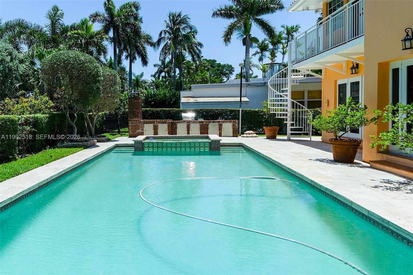 5309 Alton Road Miami Beach, FL 33140 - Photo 37 of 51 a view of a swimming pool with a patio