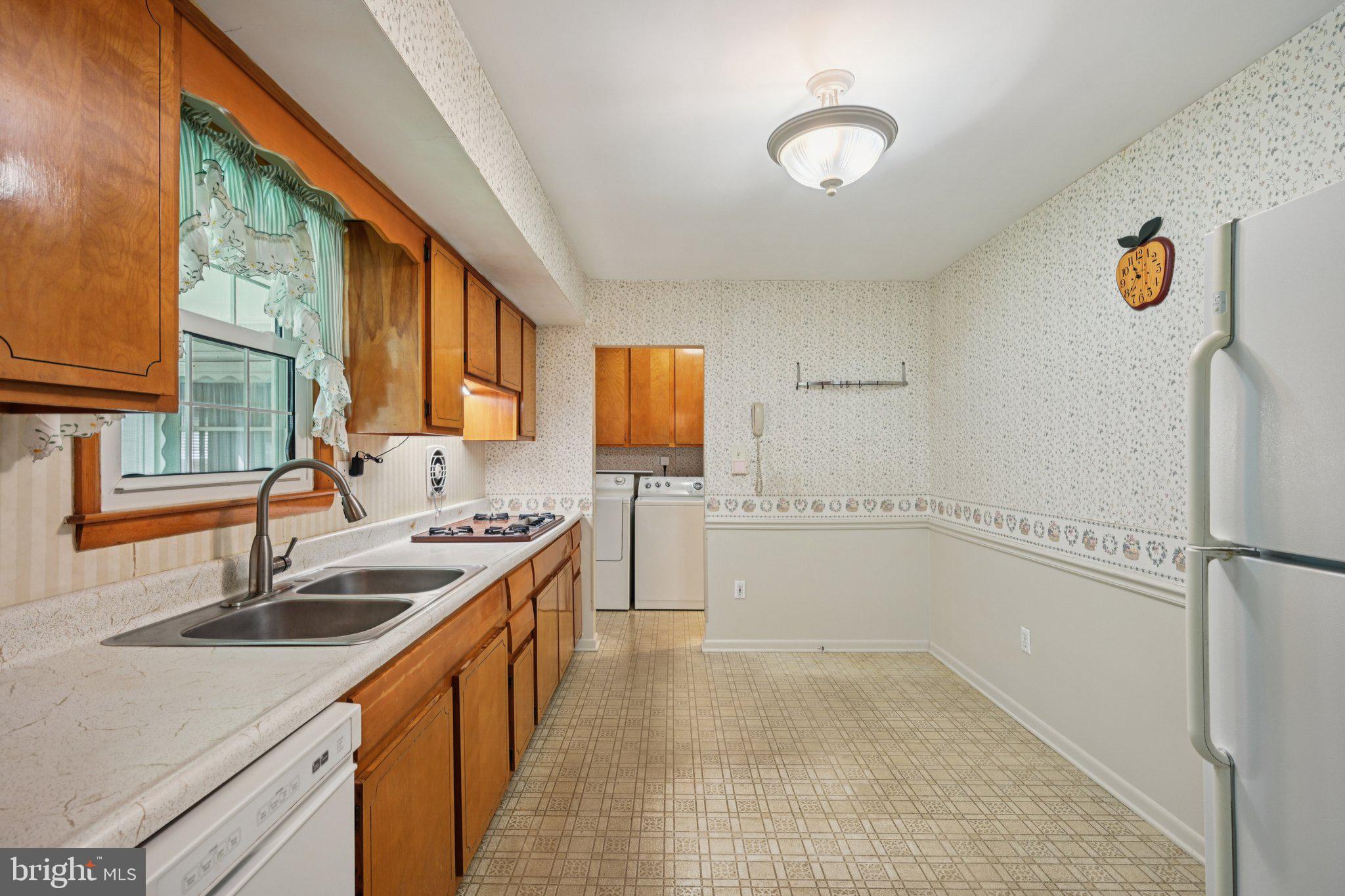 9 Cooper Tomlinson Road Medford, NJ 08055 - Photo 12 of 39 a kitchen with a sink and a refrigerator
