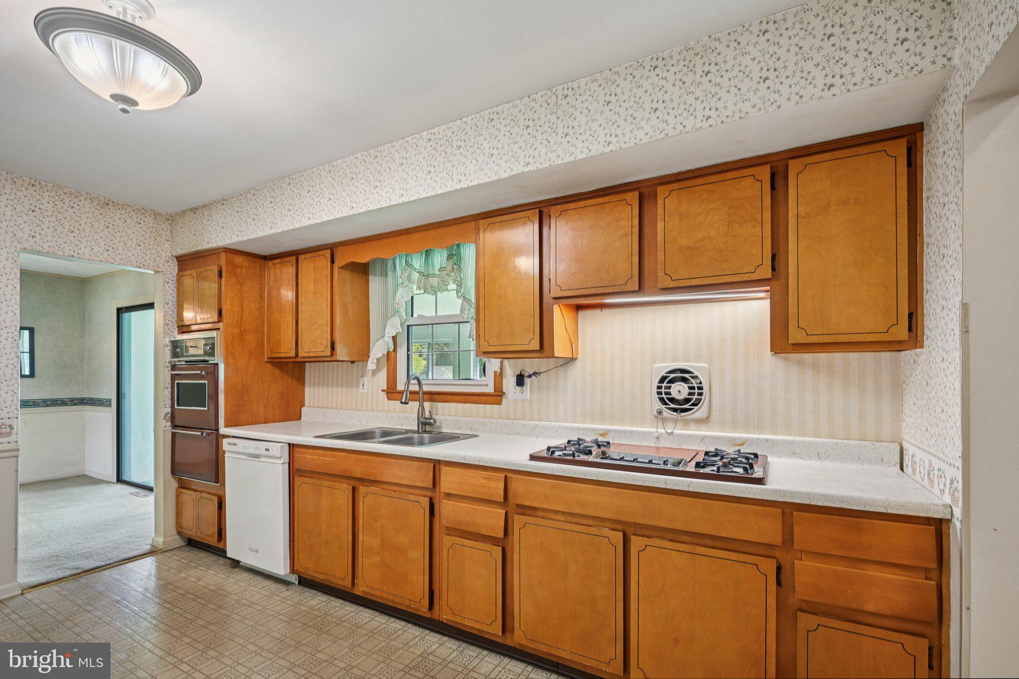 9 Cooper Tomlinson Road Medford, NJ 08055 - Photo 13 of 39 a kitchen with stainless steel appliances granite countertop a sink and a white cabinets