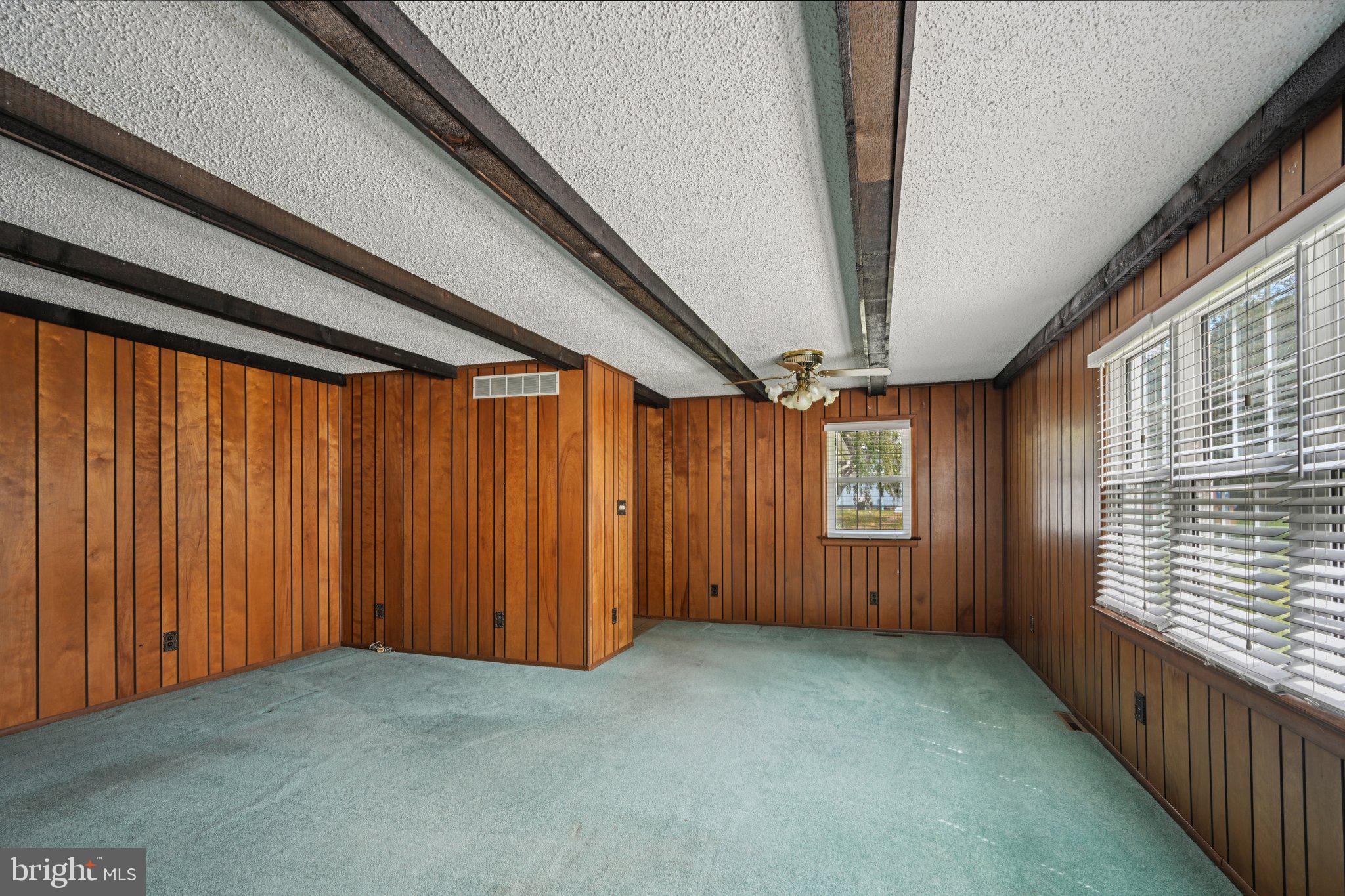 9 Cooper Tomlinson Road Medford, NJ 08055 - Photo 18 of 39 a view of an empty room with a window