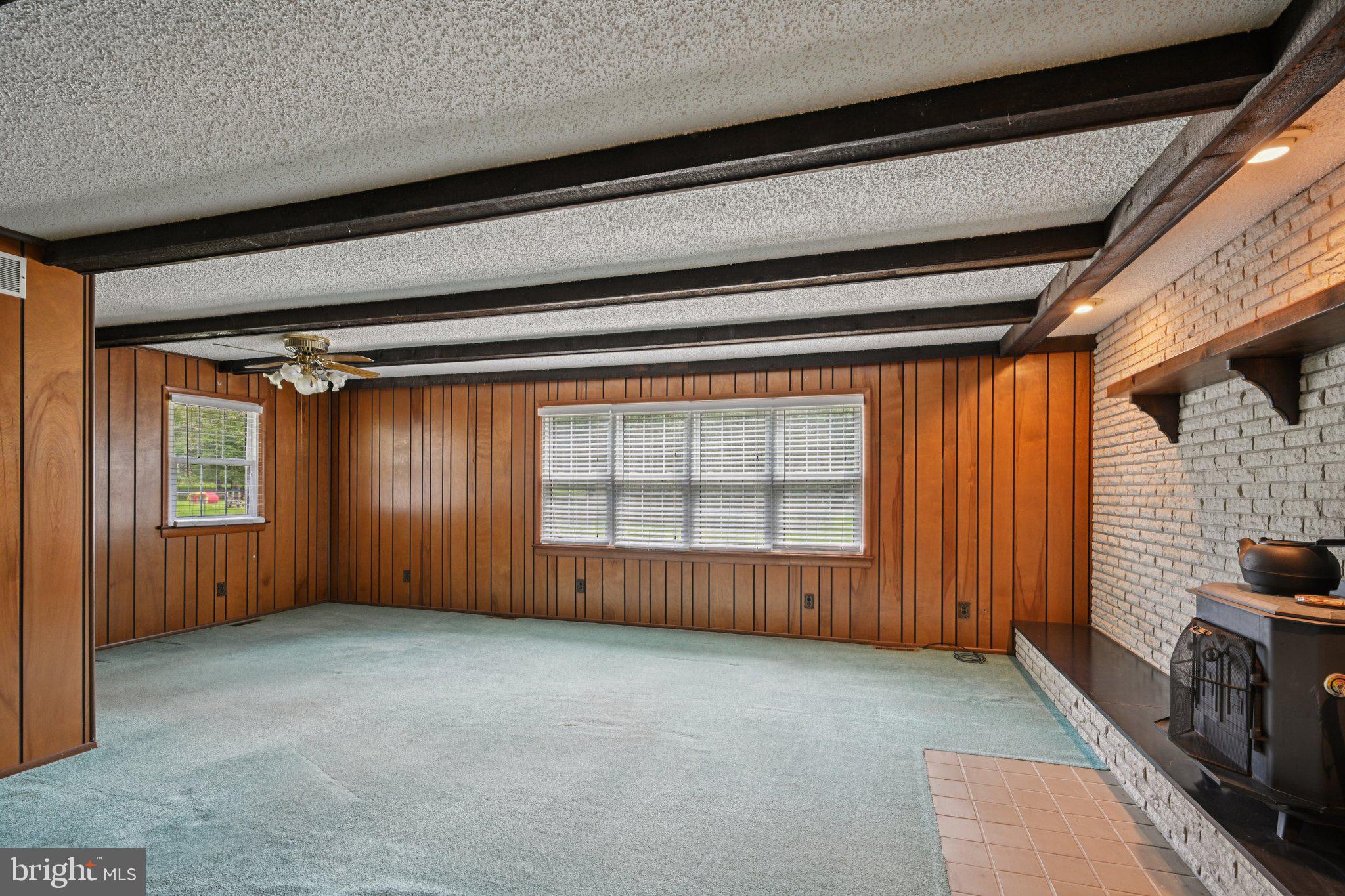 9 Cooper Tomlinson Road Medford, NJ 08055 - Photo 19 of 39 a view of an empty room with a fireplace and a window