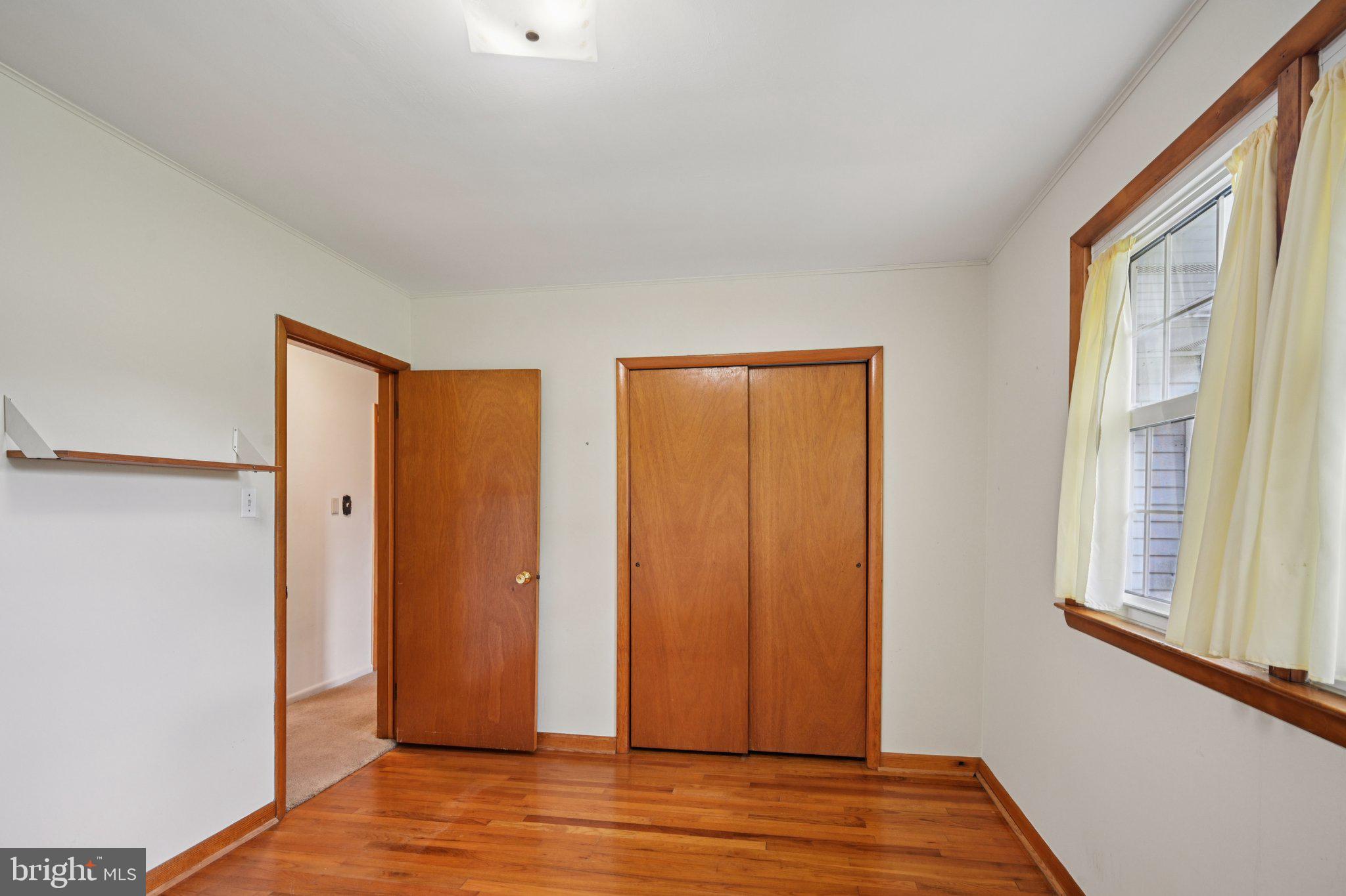 9 Cooper Tomlinson Road Medford, NJ 08055 - Photo 22 of 39 a view of empty room with wooden floor and fan