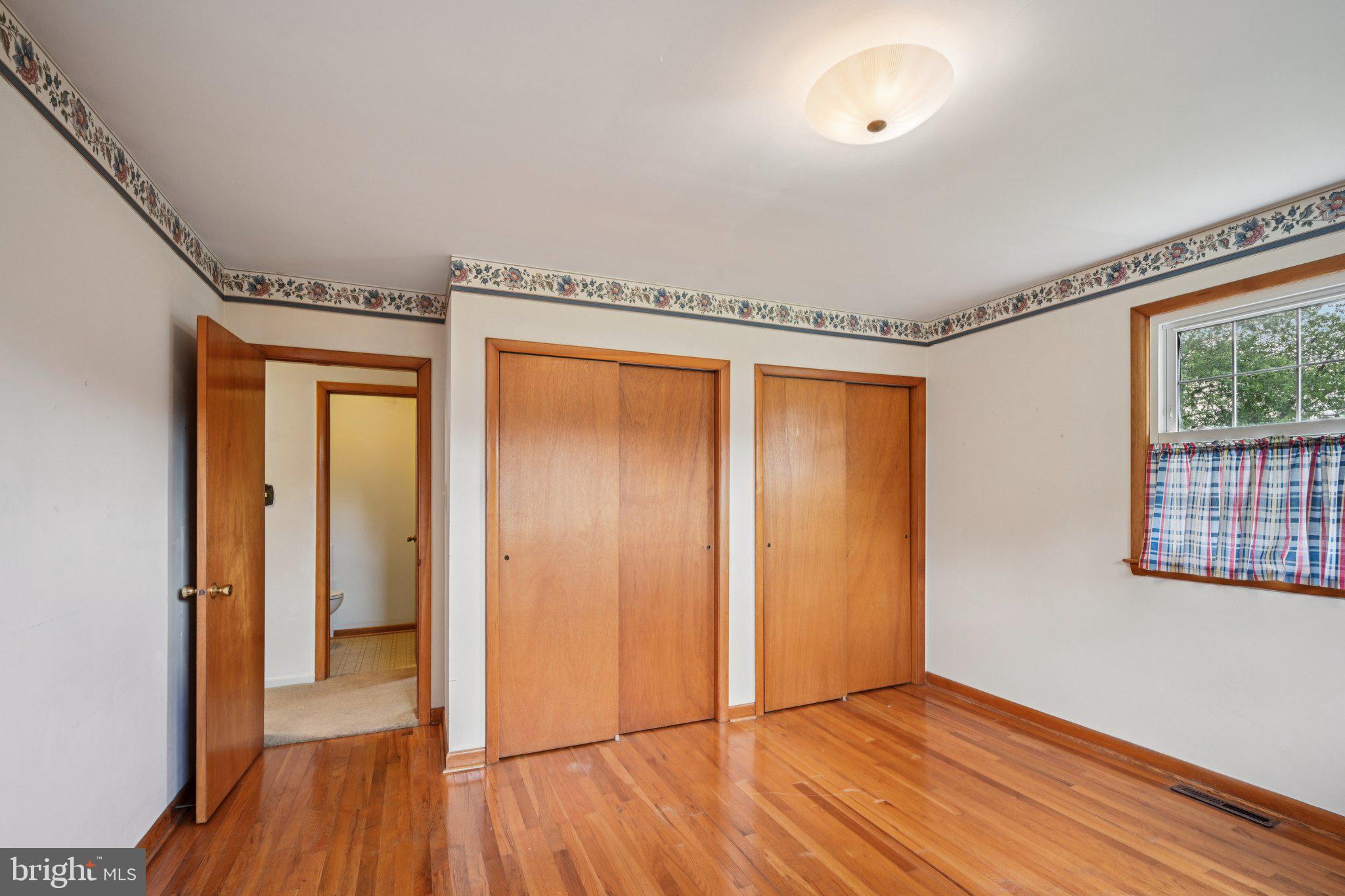 9 Cooper Tomlinson Road Medford, NJ 08055 - Photo 24 of 39 wooden floor in an empty room with a window