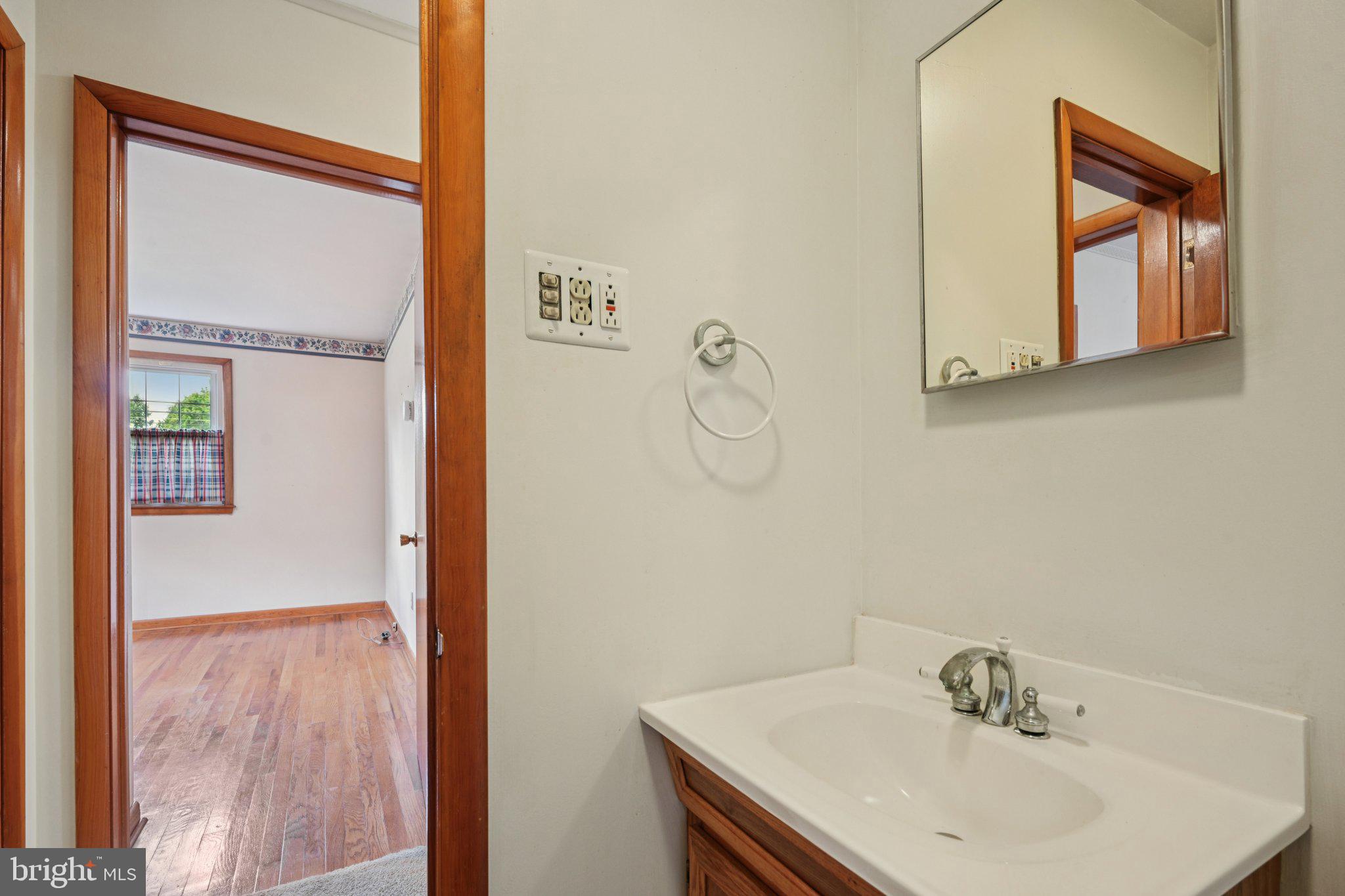 9 Cooper Tomlinson Road Medford, NJ 08055 - Photo 29 of 39 a bathroom with a sink a mirror and shower view