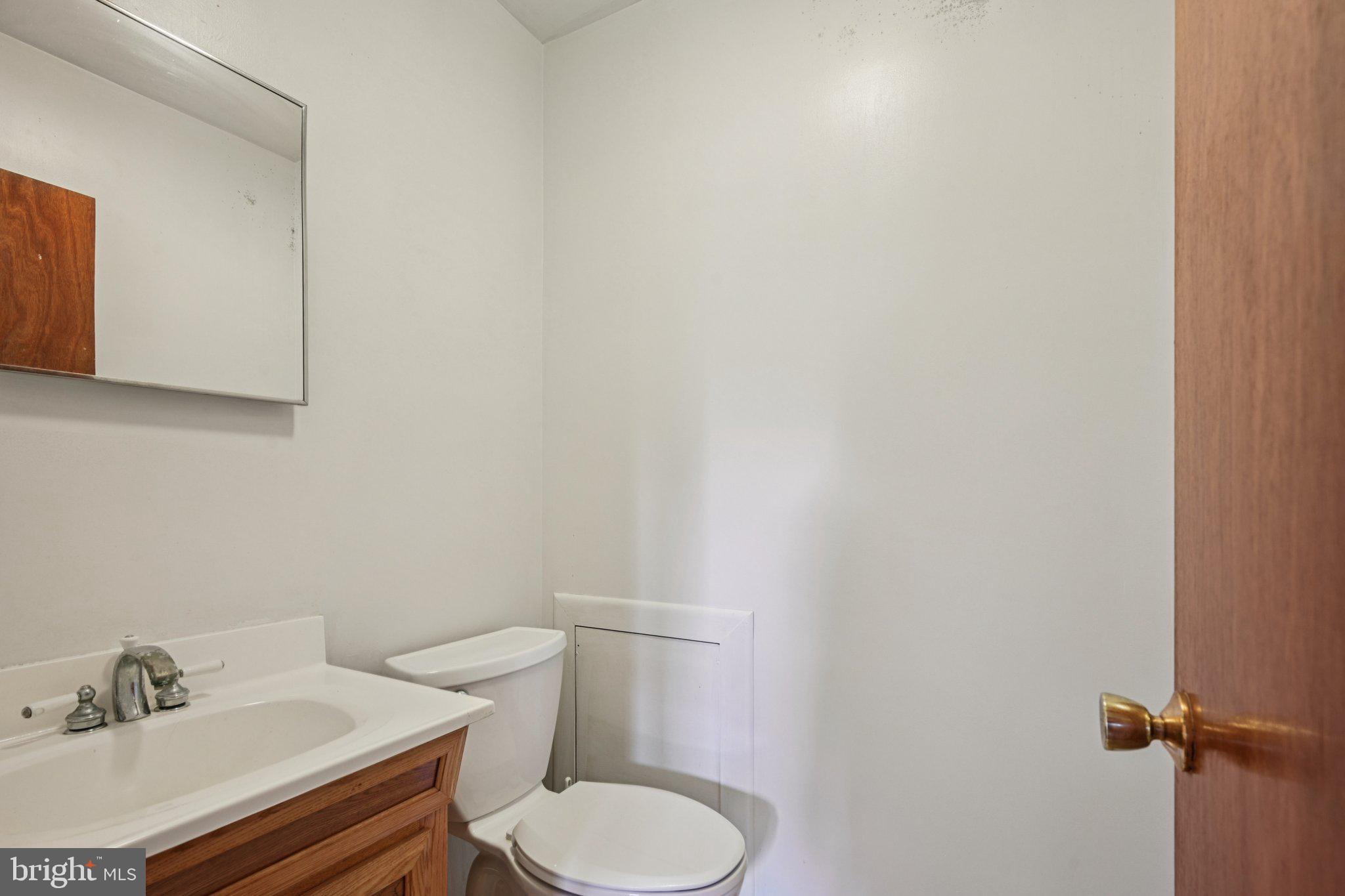 9 Cooper Tomlinson Road Medford, NJ 08055 - Photo 30 of 39 a white toilet sitting next to a bathroom sink
