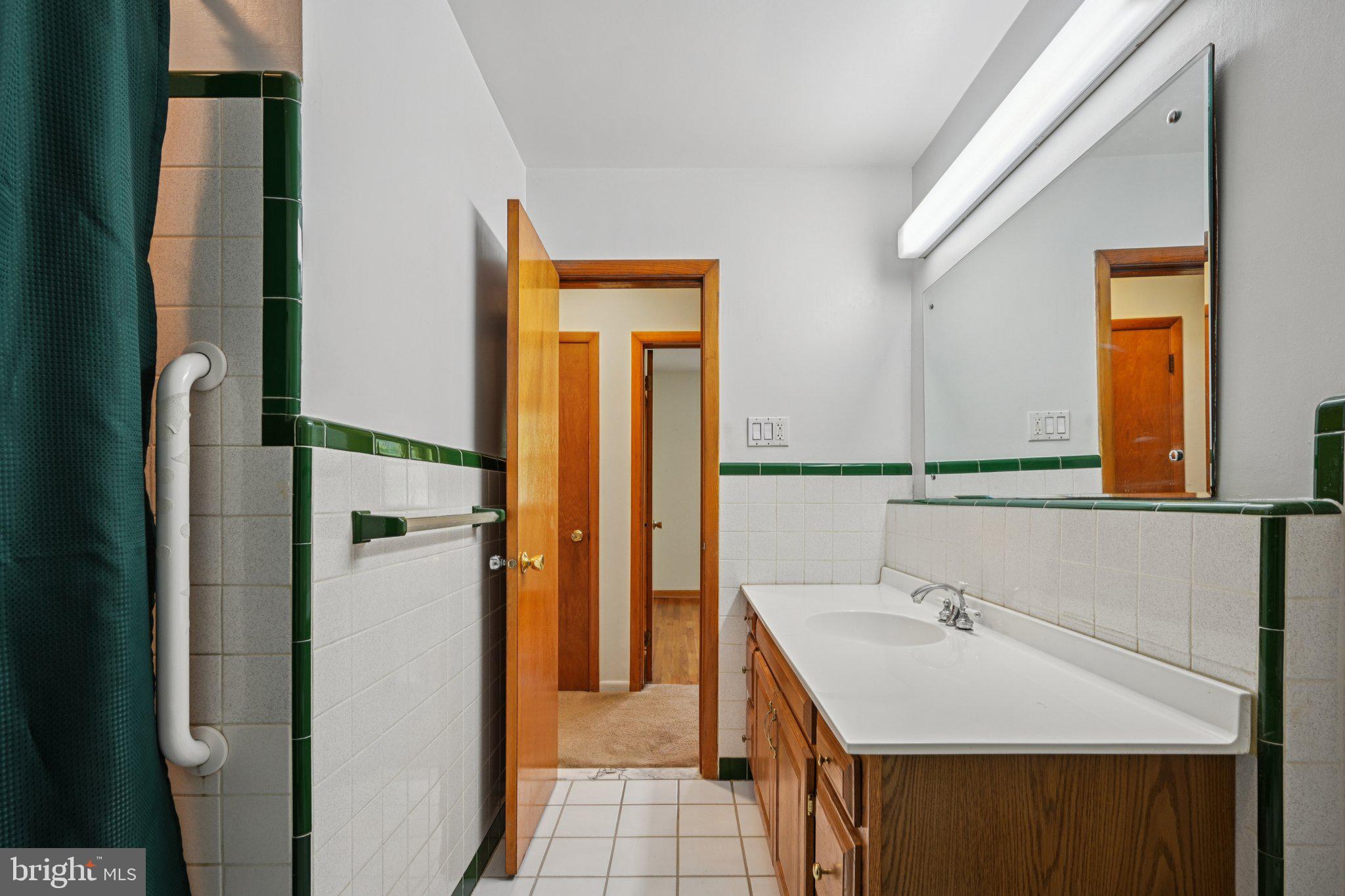 9 Cooper Tomlinson Road Medford, NJ 08055 - Photo 32 of 39 a bathroom with a sink and a mirror